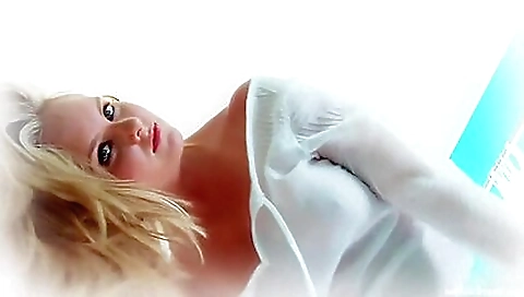 Fantastic teen in a bed with her eyes closed on the bed