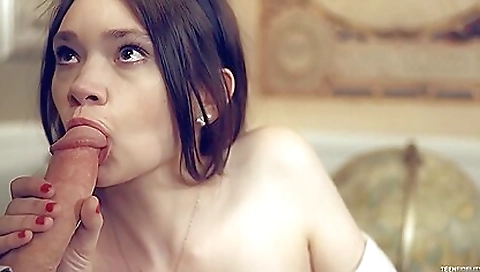 Skinny redhead with an attractive smile sucks a cumshot on his dick