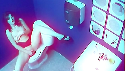 Busty brunette in red lingerie fingering her pussy