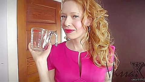 Big tits redhead shows off her body in a sexy dress