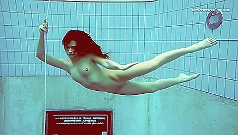 Horny brunette with small tits naked and playing with her cunt