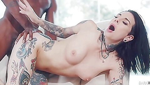 Brunette with a tattooed pussy and ass fucked on a white bed