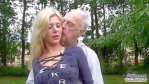 Hot blonde in a black t-shirt and shorts in the gym