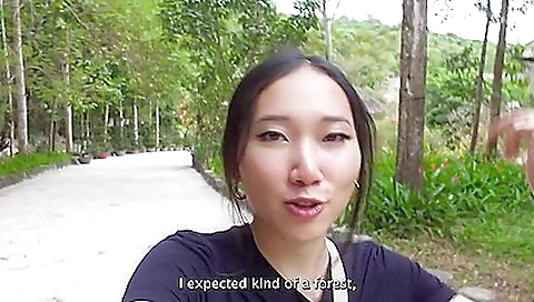 Asian brunette enjoys a wild ride on a big dick in an island adventure