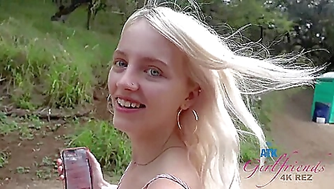 A horny blonde is getting her pussy fucked on the cliffs